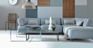 blue and gray living room with minimal clutter to suggest how to transform a living room on a budget by decluttering