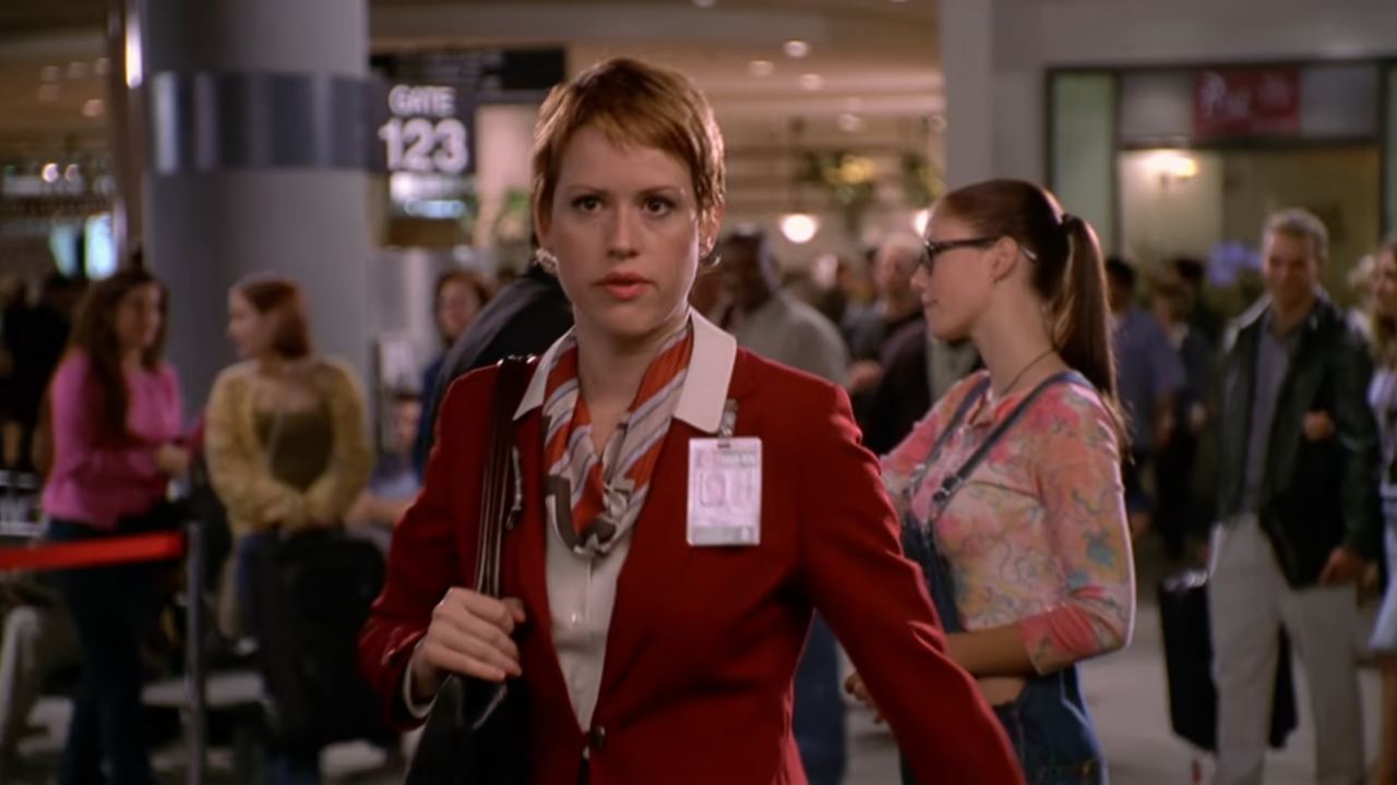 Molly Ringwald walks away from a teen couple in exasperation in Not Another Teen Movie.