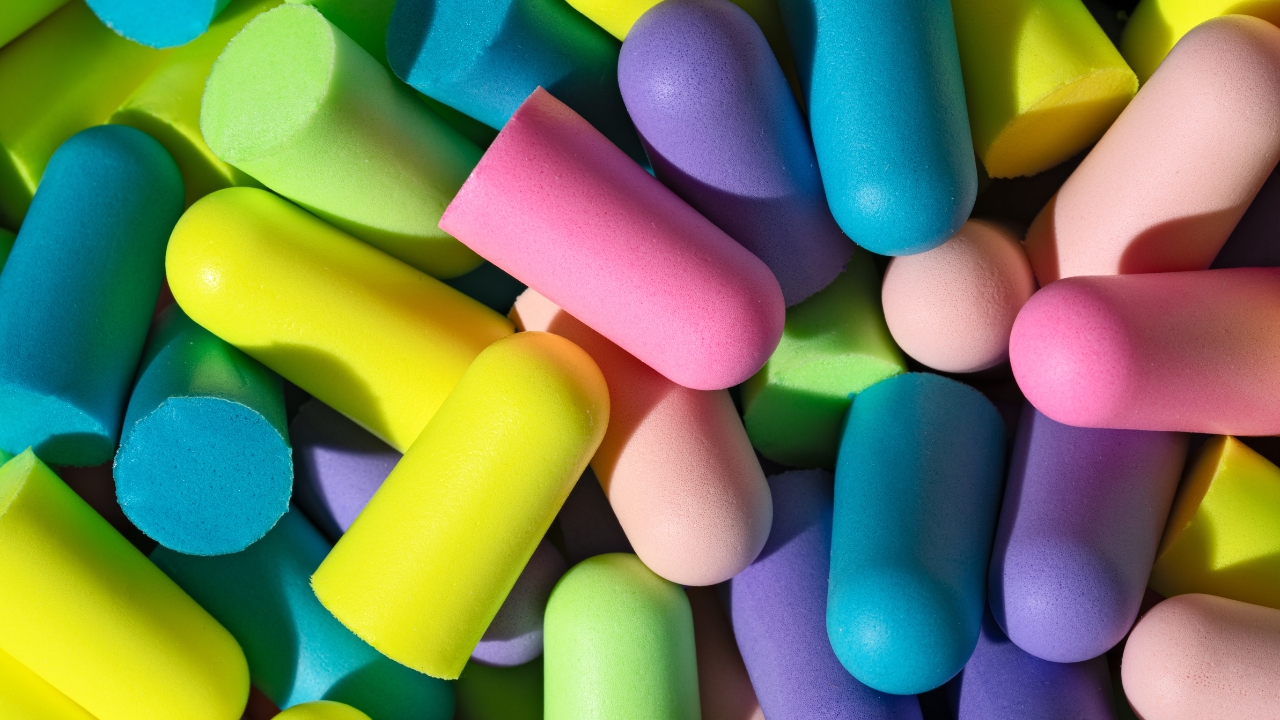 Lots of multi-coloured foam earplugs