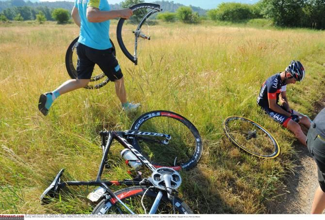 Jerome Pineau (IAM Cycling) needs help after a crash at the Dauphine in June