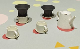 Set of a ceramic cut and teapot.