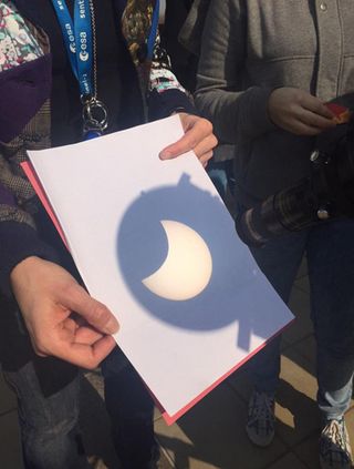 Eclipse watchers see a projection of the total solar eclipse of 2015 at the European Space Agency's ESRIN facility in Frascati, Italy near Rome. From most of Europe, only a partial solar eclipse was visible.