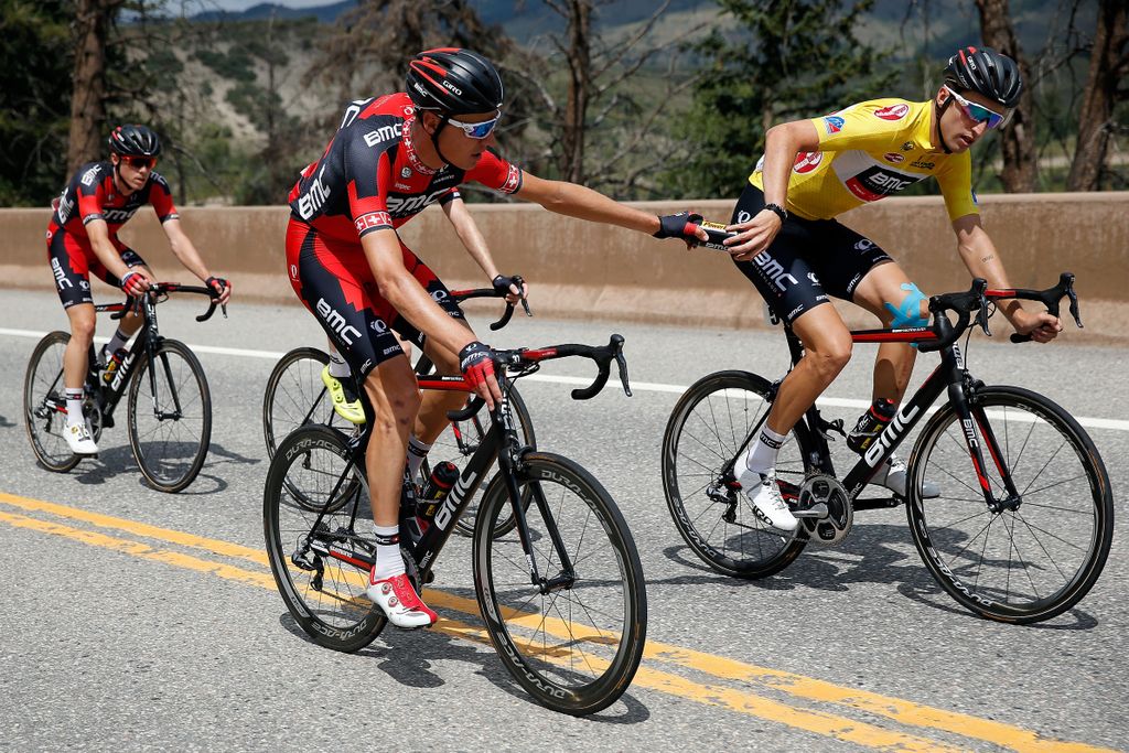Michael Sch&auml;r hands BMC teammate Taylor Phinney a bidon