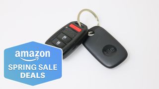 A car key with a Tile Pro bluetooth tracker on a keychain