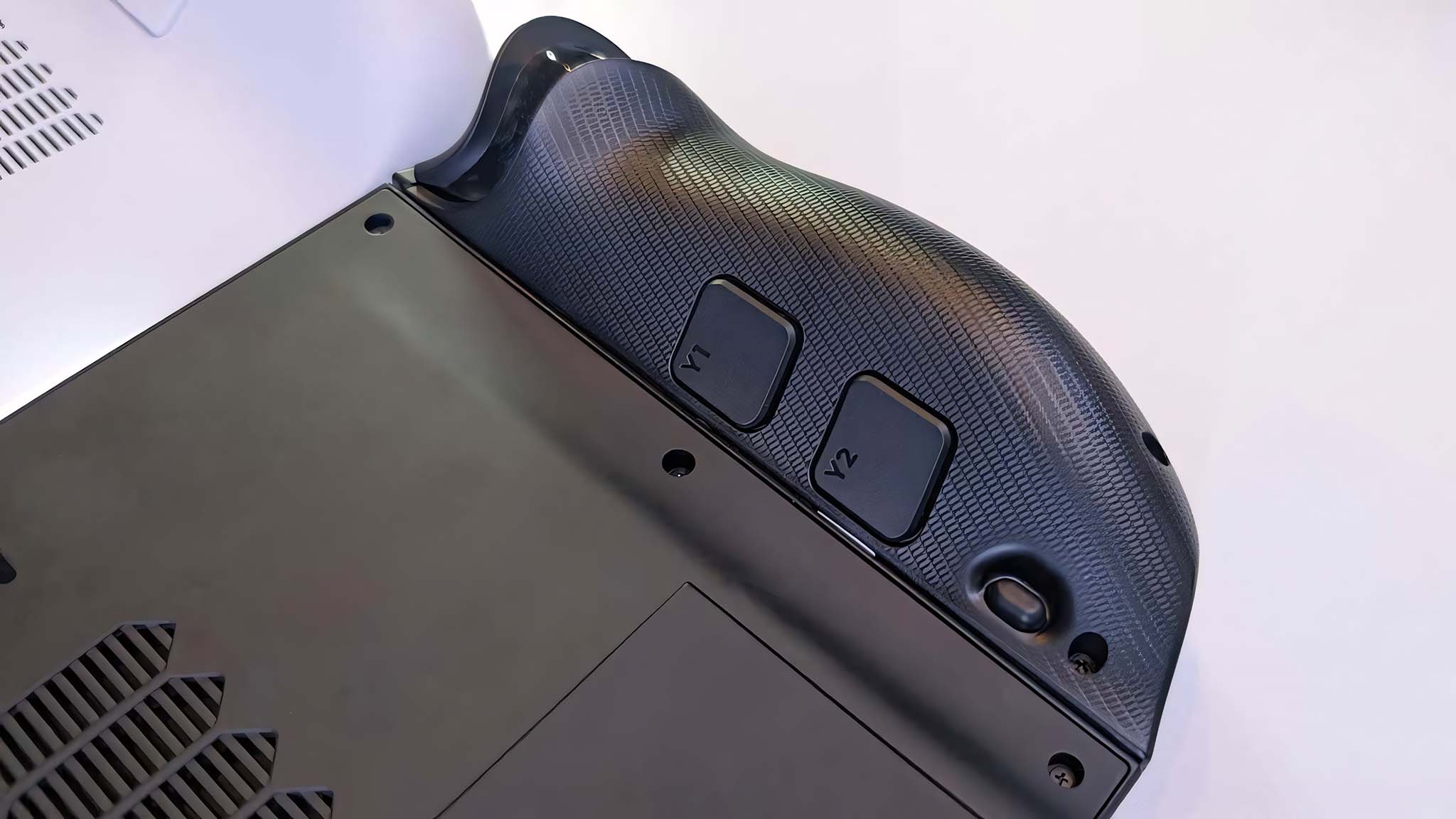 Closeup of the Lenovo Legion Go 2's Y1 and Y2 buttons on the back of the left controller.