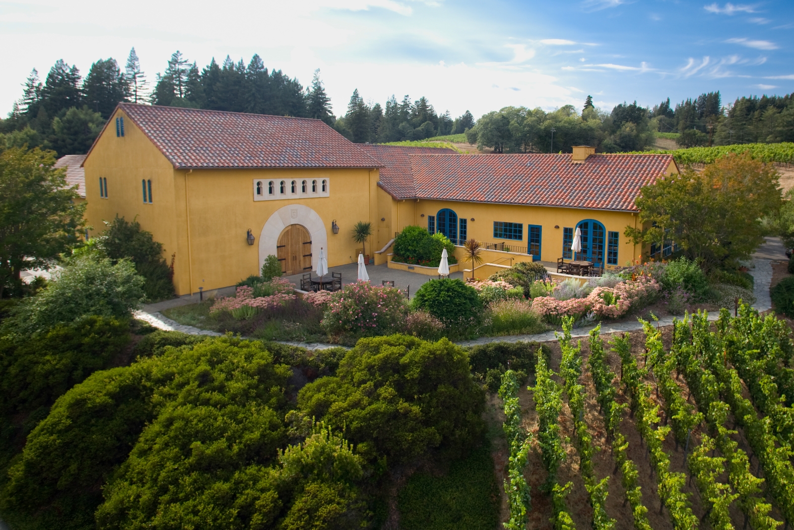 An aerial view of the Catalan-style Marimar Estate winery and tasting room, along with a small portion of estate vineyard in the Russian River Valley.
