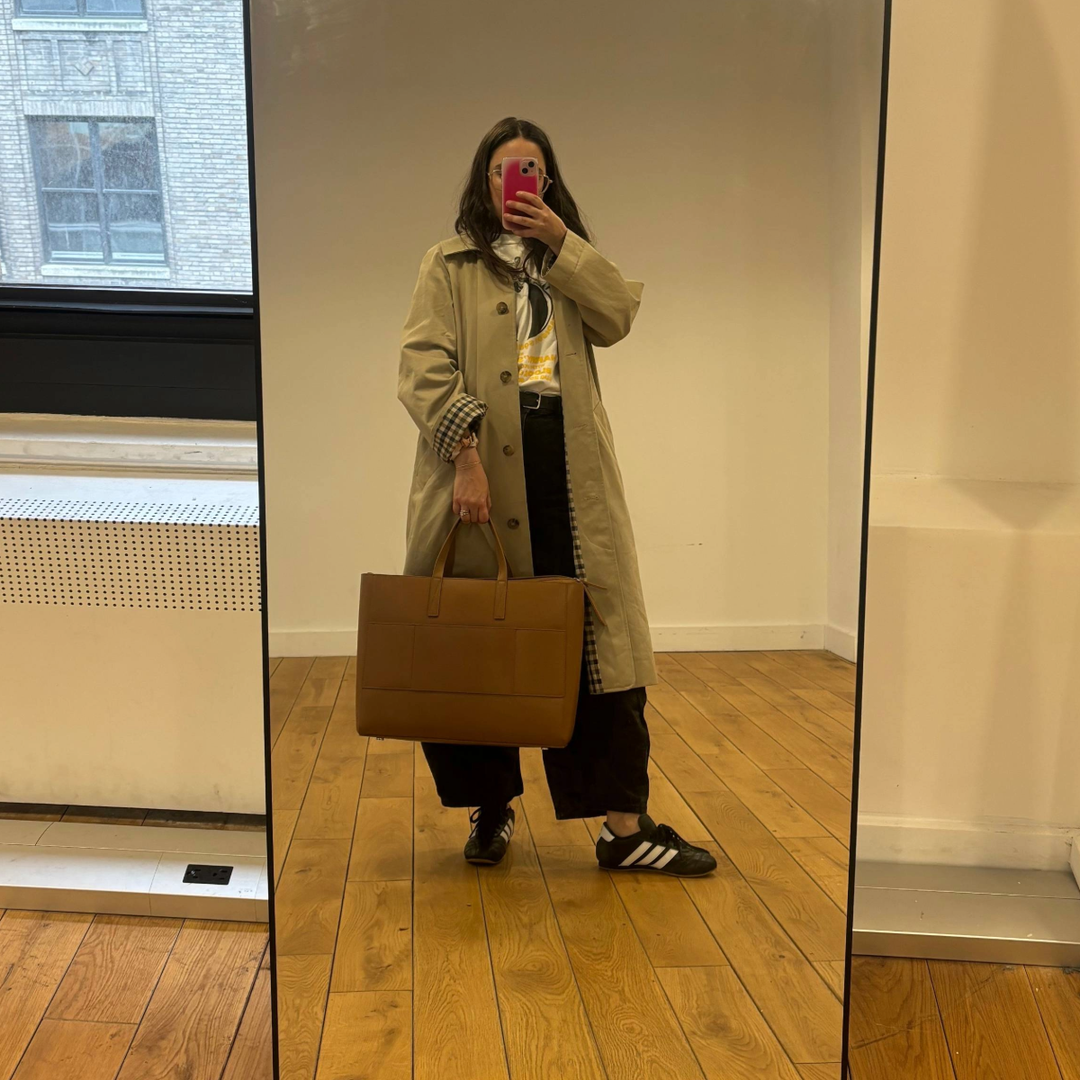 Fashion E-Commerce Editor Julia Marzovilla tests the Calpak Haven Laptop Tote Bag in "Toffee."