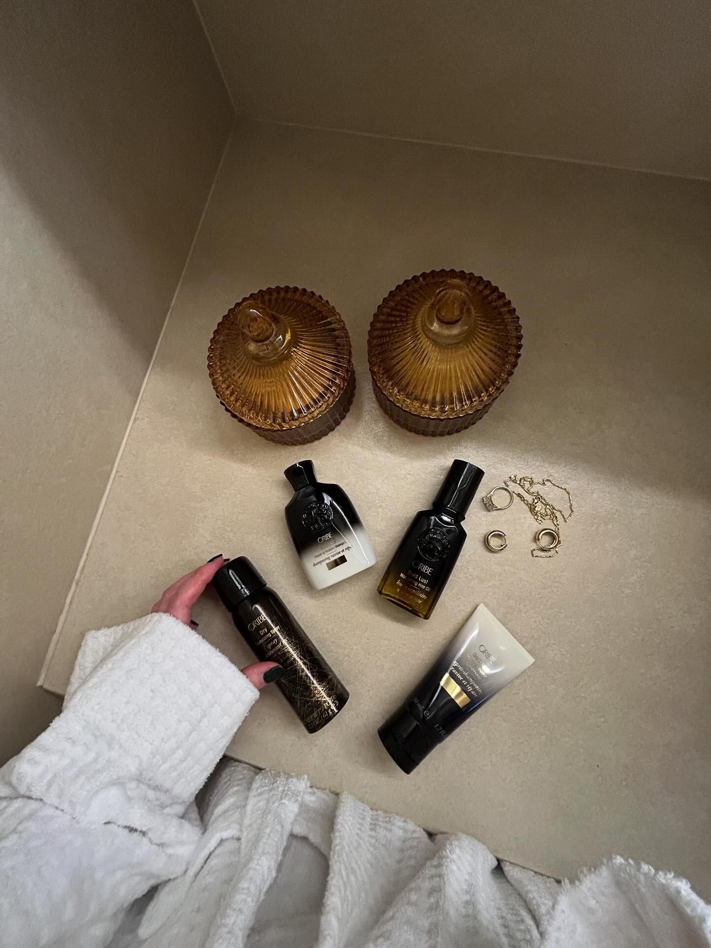 The side of a hotel bathroom with Oribe products displayed