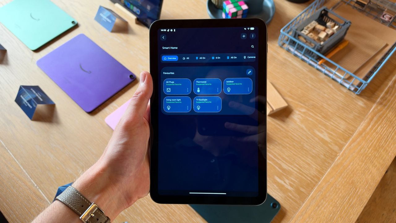The Amazon Alexa Tablet 8 being held in the hand
