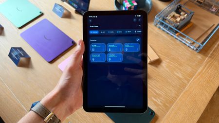 The Amazon Alexa Tablet 8 being held in the hand