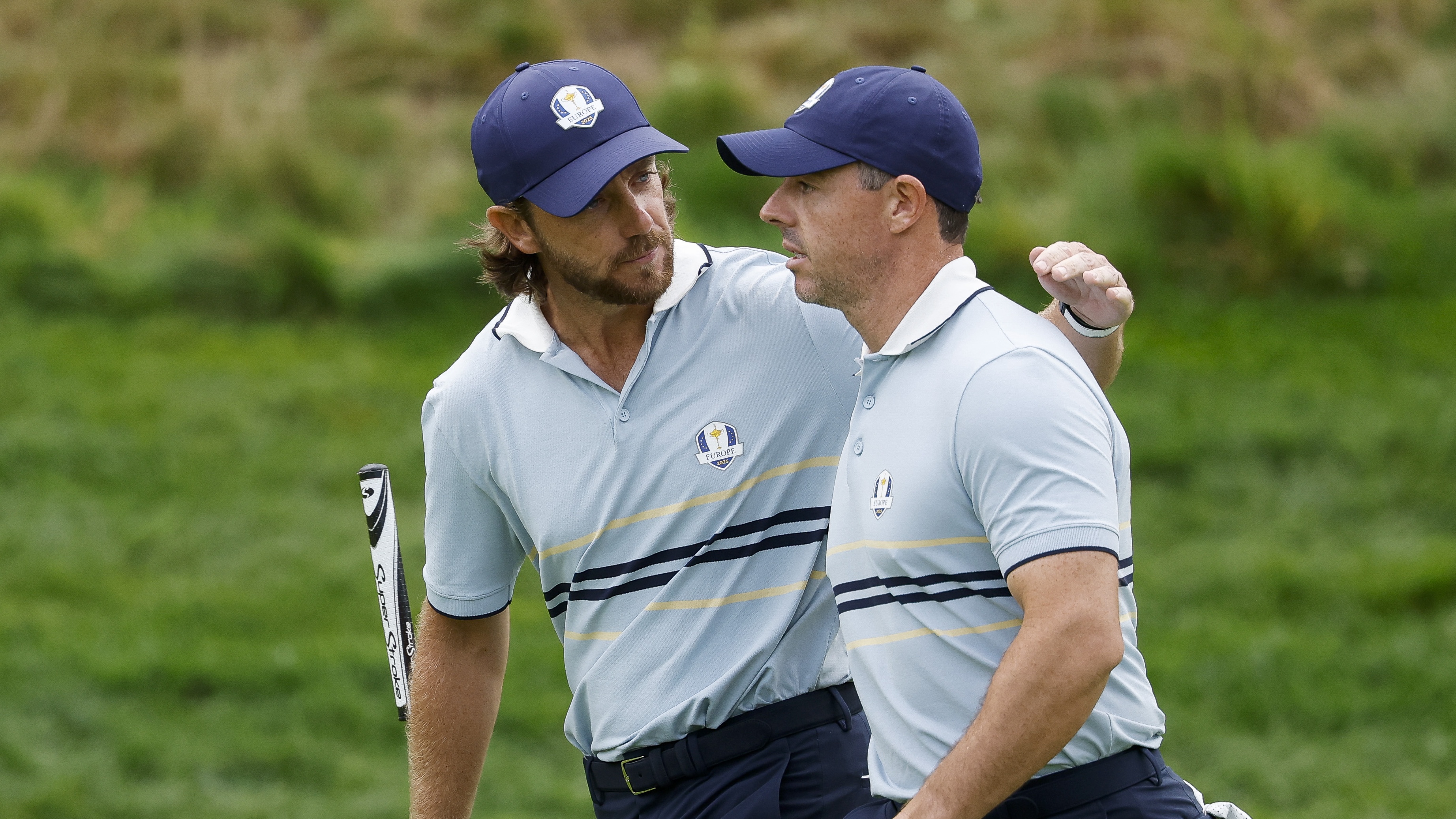 Tommy Fleetwood and Rory McIlroy of Team Europe celebrate on the eighth green during the Friday morning foursomes matches of the 2025 Ryder Cup at Black Course at Bethpage State Park Golf Course on September 26, 2025 in Farmingdale, New York.