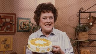 Julia Child holds a cake