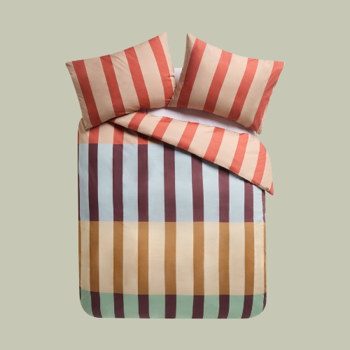 striped duvet cover on a sage green background