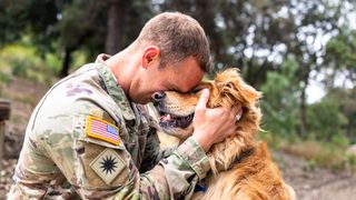 Man hugging dog