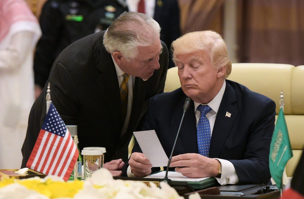 Secretary of State Rex Tillerson talks with Trump