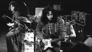 Rory Gallagher performs live in London with bassist Gerry McAvoy in 1973 