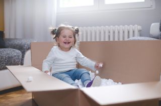 Experts reveal why babies really love putting things in boxes