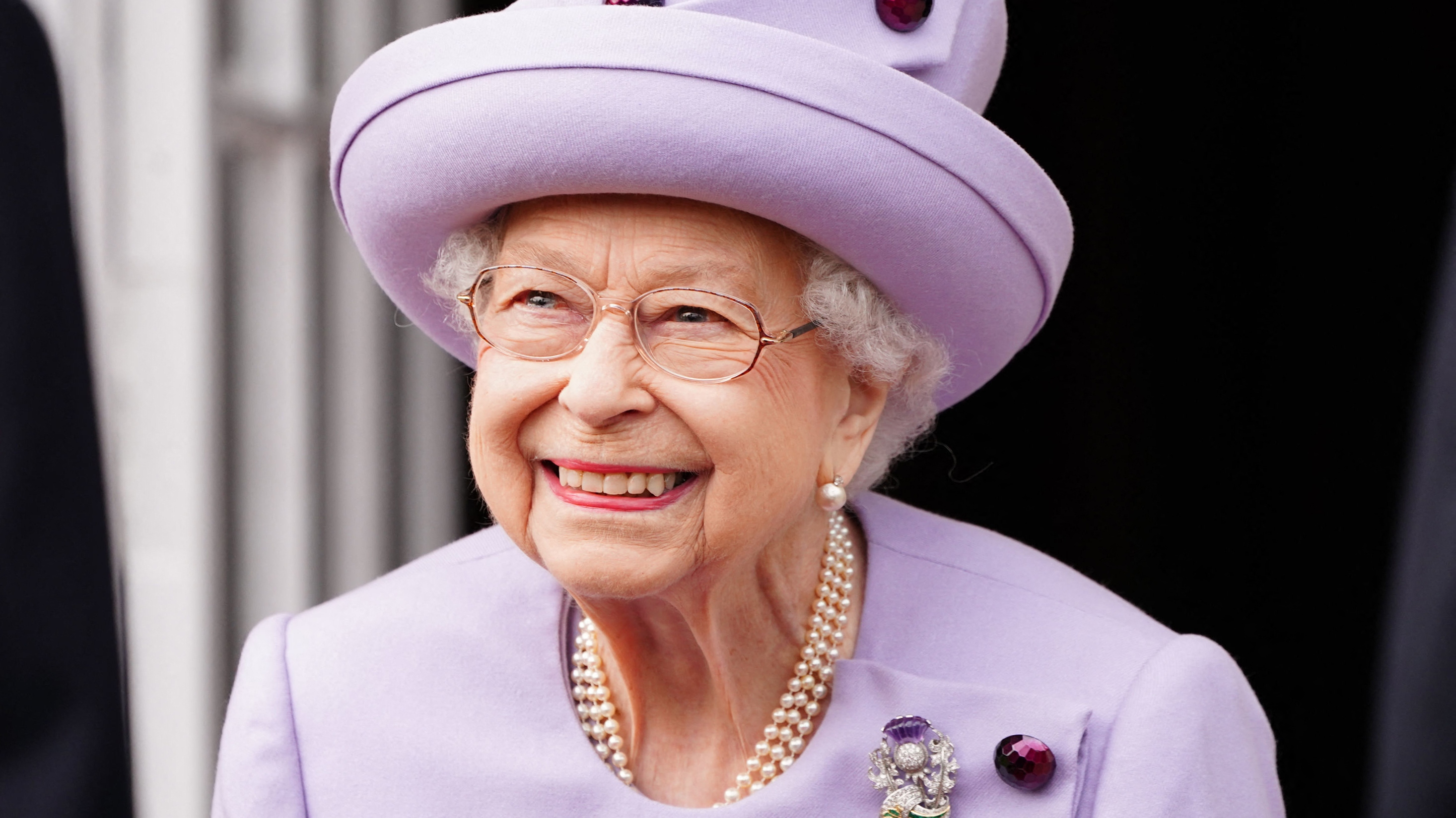 Queen Elizabeth II smiles as she attends an Armed Forces Act of Loyalty Parade at the Palace of Holyroodhouse in Edinburgh, Scotland, on June 28, 2022