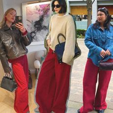 Elsa, Chloe, and Marina wearing red pants outfits.