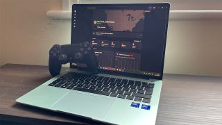 NordVPN connected on Windows laptop, with PS4 controller resting on the keyboard 