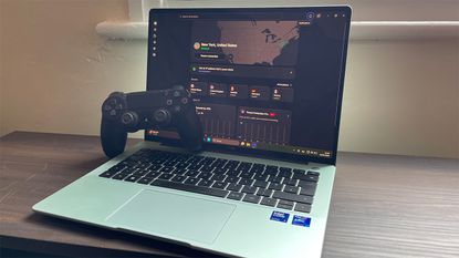 NordVPN connected on Windows laptop, with PS4 controller resting on the keyboard 