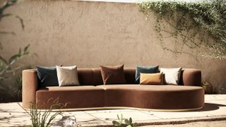 rendered wall on patio with large outdoor sofa