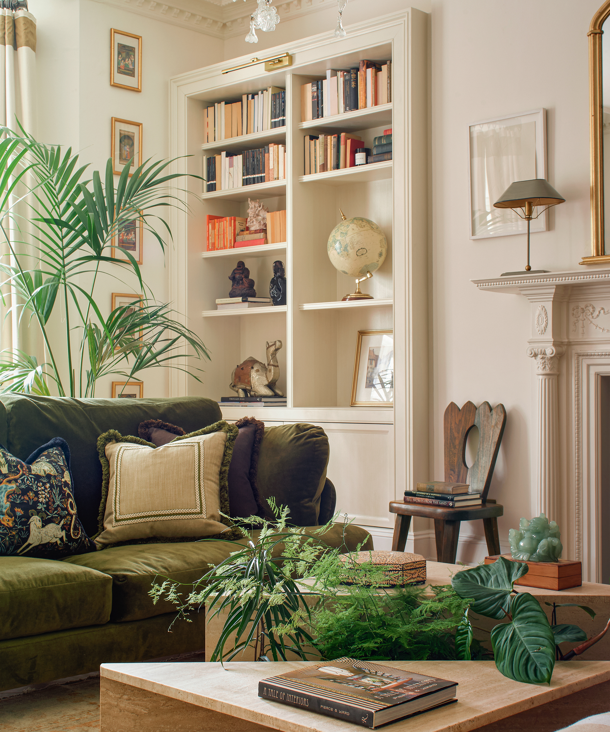 living room with green sofa and white walls