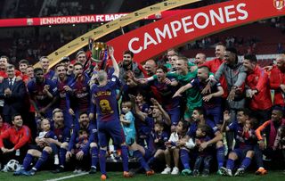 Andres Iniesta celebrates with his team-mates after Barcelona's Copa del Rey final win over Sevilla in April 2018.