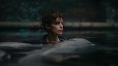 A still of a woman in water from Netflix's Under Paris