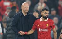 LIVERPOOL, ENGLAND - NOVEMBER 5: Arne Slot Manager of Liverpool congratulates Mohamed Salah of Liverpool after the 4-0 victory during the UEFA Champions League 2024/25 League Phase MD4 match between Liverpool FC and Bayer 04 Leverkusen at Anfield on November 5, 2024 in Liverpool, England. (Photo by Crystal Pix/MB Media/Getty Images)