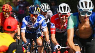 GRANADA, SPAIN - AUGUST 25: (L-R) Primoz Roglic of Slovenia and Team Red Bull Bora - hansgrohe - Polka dot Mountain Jersey and Ben O'Connor of Australia and Team Decathlon AG2R La Mondiale - Red Leader Jersey competes during the La Vuelta - 79th Tour of Spain 2024, Stage 9 a 178.5km stage from Motril to Granada / #UCIWT / on August 25, 2024 in Granada, Spain. (Photo by Dario Belingheri/Getty Images)