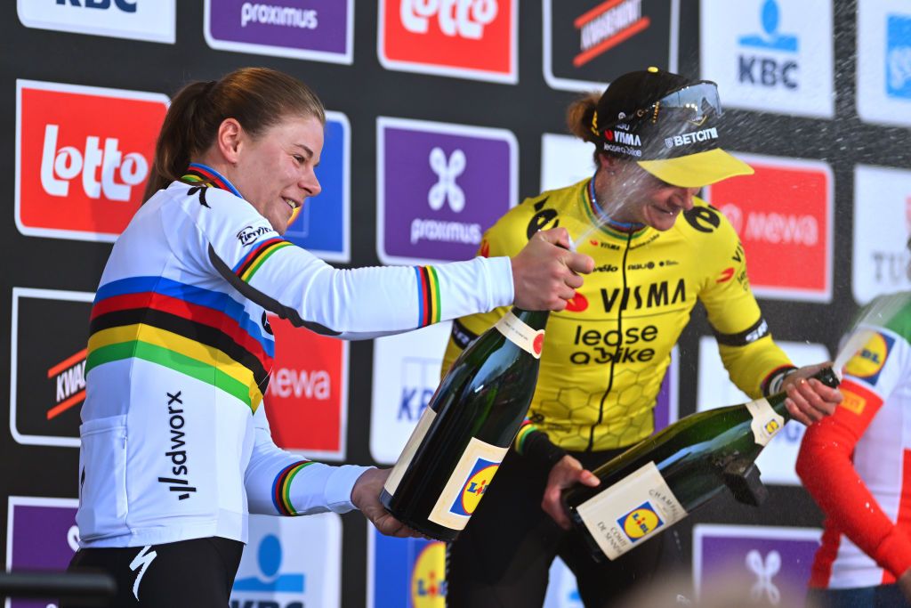 NINOVE BELGIUM FEBRUARY 24 LR Lotte Kopecky of Belgium and Team SD WorxProtime on second place and race winner Marianne Vos of The Netherlands and Team Visma Lease A Bike pose and celebrate on the podium ceremony after the 16th Omloop Het Nieuwsblad 2024 Womens Elite a 1271km one day race from Ghent to Ninove UCIWWT on February 24 2024 in Ninove Belgium Photo by Luc ClaessenGetty Images