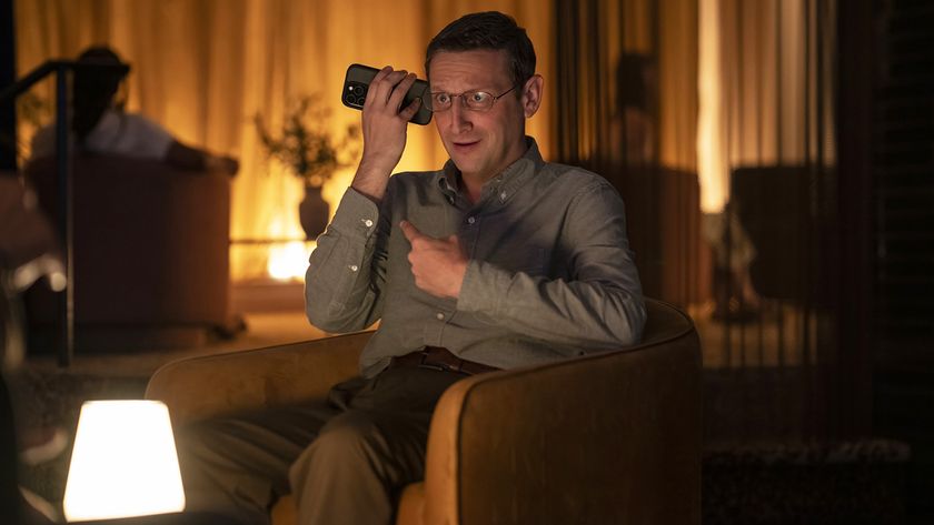 Ron Trosper sitting down and talking on a mobile phone in The Chair Company