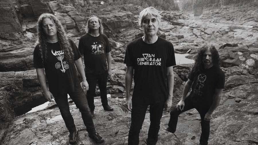 Voivod standing amongst some rocks