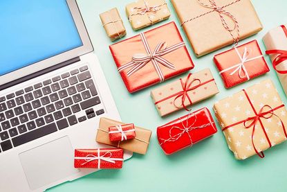 after Christmas sales - a selection of wrapped presents next to a laptop