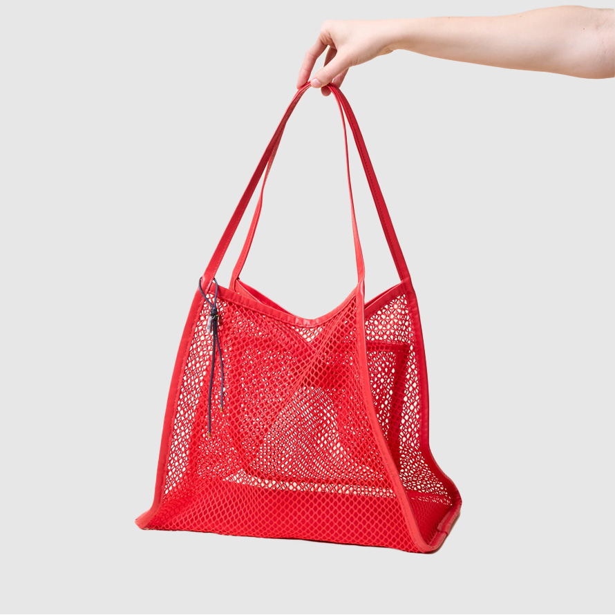 Red mesh tote bag.