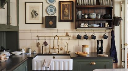 Butler sink kitchen area with open dish rack and hanging rail