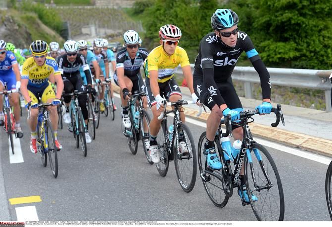 Chris Froome rides ahead of Tour de Romandie leader Michal Kwiatkowski