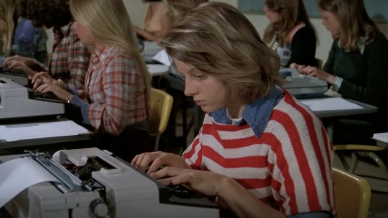 Ellen (in Annabel's body) trying to work an electric typewriter at school.