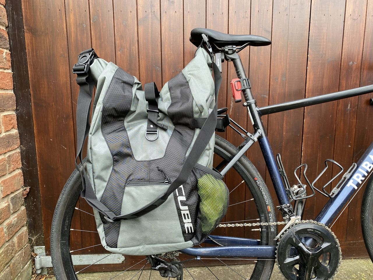 Roll top closure and shoulder strap