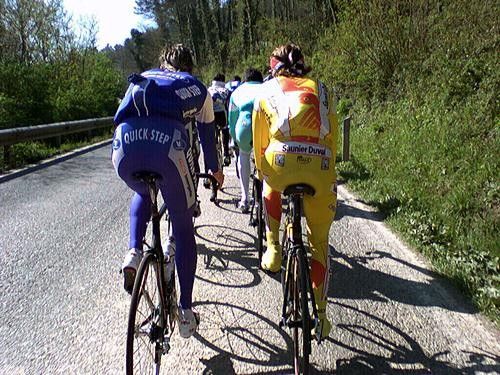 Following ProTour wheels. Quickstep and Saunier Duval riders form part of a chaingang headed to Mount Serra for climbing work.