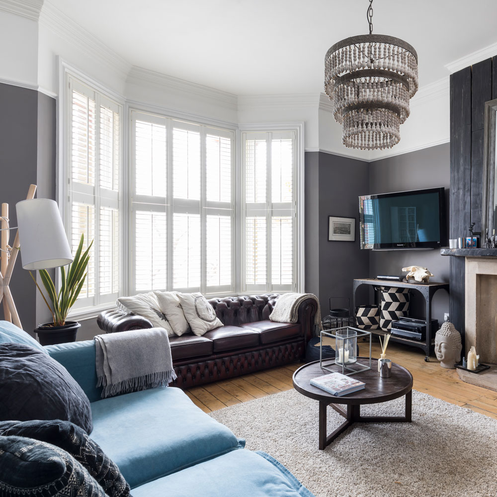 living room with with wooden floor and white window and tv