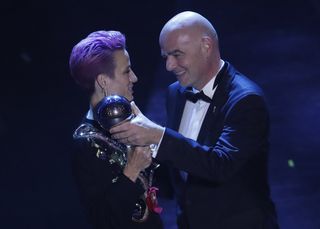 Megan Rapinoe receives the Best FIFA Women’s player award from FIFA president Gianni Infantino