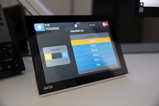 A security control center display using AMX by Harman technology.