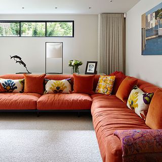 family room with sofa and floral cushion