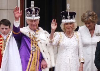 King Charles III and Queen Camilla can be seen on the Buckingham Palace balcony ahead of the flypast during the Coronation of King Charles III and Queen Camilla on May 06, 2023 in London, England. The Coronation of Charles III and his wife, Camilla, as King and Queen of the United Kingdom of Great Britain and Northern Ireland, and the other Commonwealth realms takes place at Westminster Abbey today. Charles acceded to the throne on 8 September 2022, upon the death of his mother, Elizabeth II.