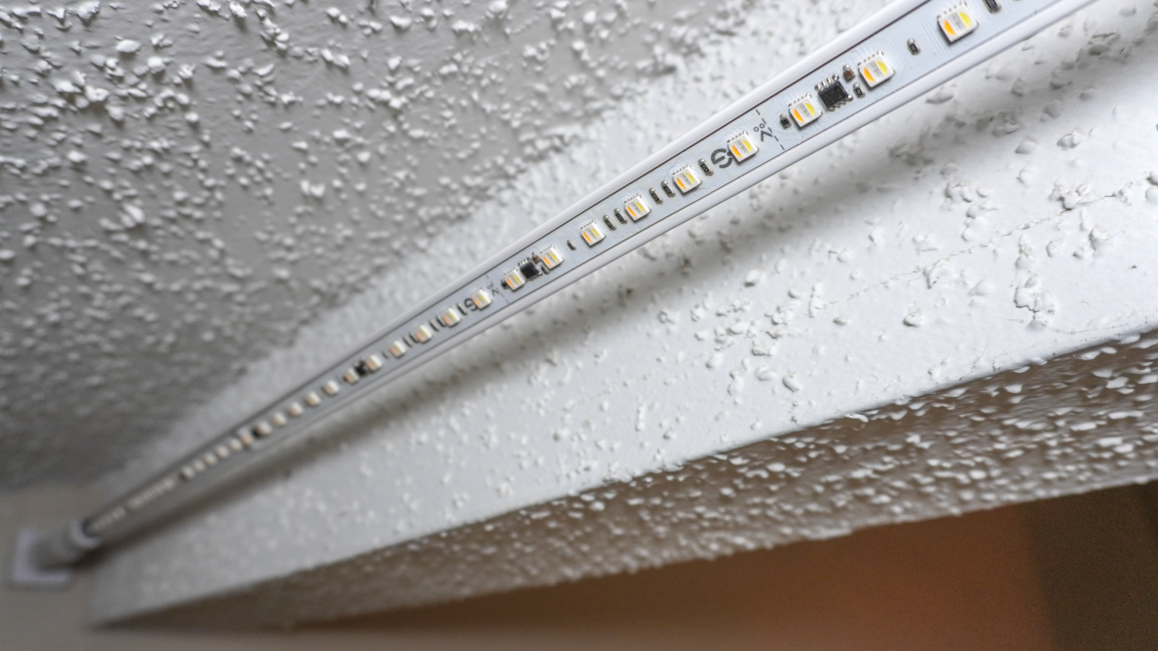 The Govee Strip Light with Skyline Kit successfully mounted behind a beam