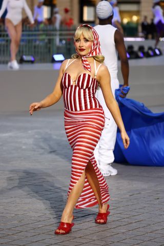 Sabrina Carpenter at the Vogue World show wearing a striped swimsuit and skirt by Jacquemus