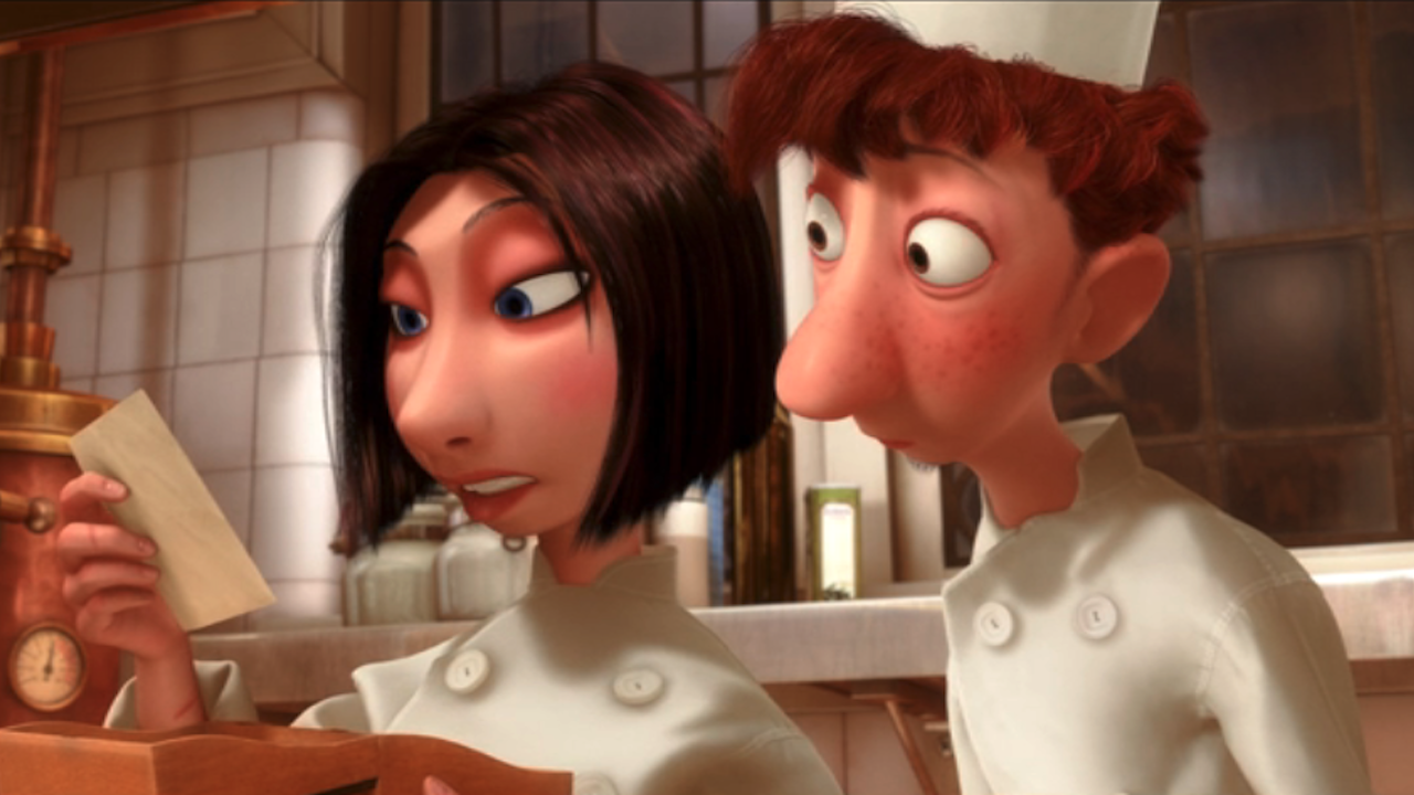 Colette and Alfredo reading a recipe in Ratatouille