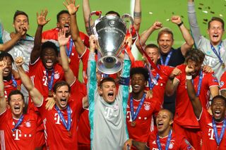 Bayern Munich captain Manuel Neuer lifts the Champions League trophy alongside his team-mates after the Bavarians' win over Paris Saint-Germain in the 2020 final.